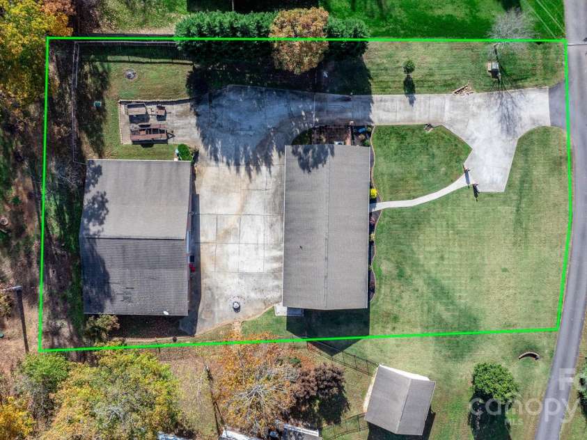 1246 Hillsboro Avenue, Hickory, NC 28602.  MLS# CAR4199854, YatesRealty ID 1745. Tons of extra parking -There is a parking pad in the front of the home for guest, and gated private entrance for owners to access garage spaces and additional parking pad behind home.