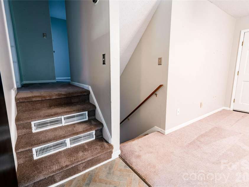 111 Harbor Point Drive, Cherryville, NC 28021.  MLS# CAR4377060, YatesRealty ID 17453. Stairs to upper level and lower level