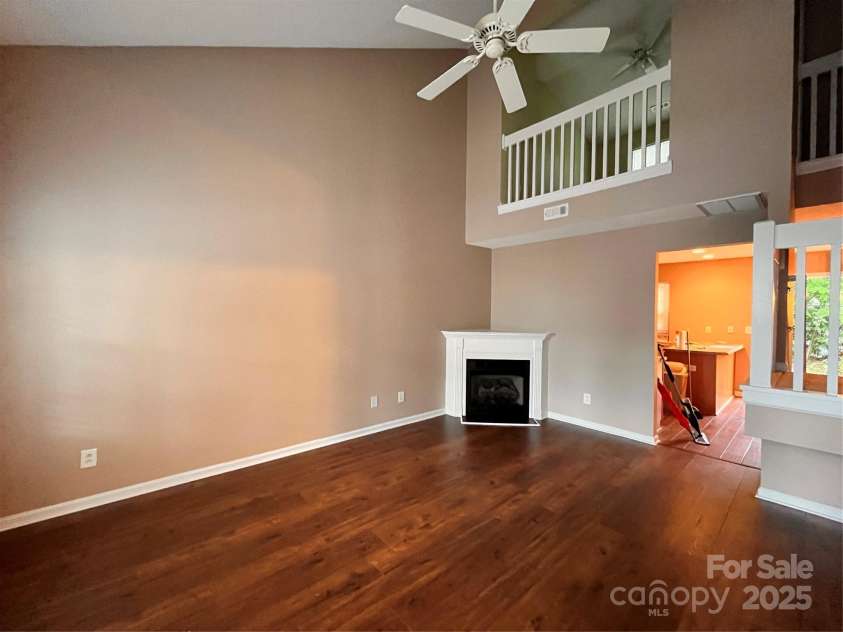 10875 Holly Ridge Boulevard, Charlotte, NC 28216.  MLS# CAR4135127, YatesRealty ID 17458. Living room w/ fireplace