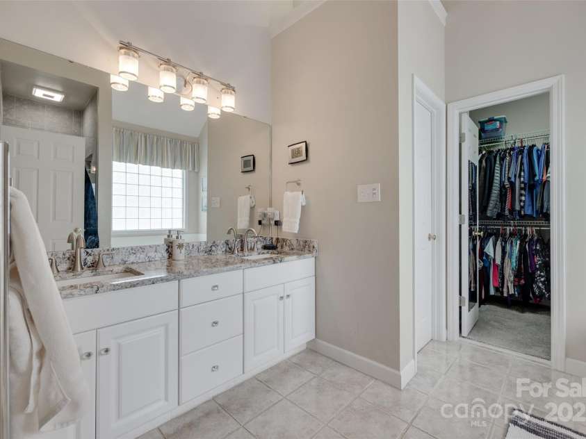 1305 Yellowood Court, Rock Hill, SC 29732.  MLS# CAR4258397, YatesRealty ID 17462. Dual sinks with plenty of storage in primary bedroom, separate water closet and walk in clothes closet.