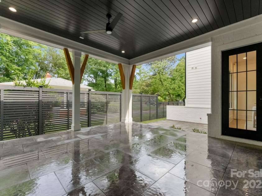 4142 Pineview Road, Charlotte, NC 28211.  MLS# CAR4127542, YatesRealty ID 17466. Covered porch with fireplace/lights/fan
