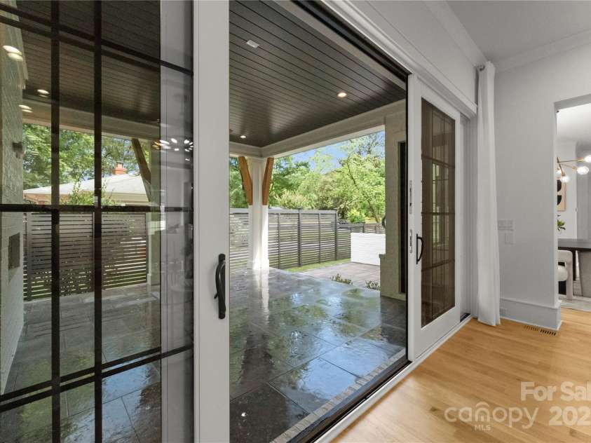 4142 Pineview Road, Charlotte, NC 28211.  MLS# CAR4127542, YatesRealty ID 17466. Double sliding doors to covered porch