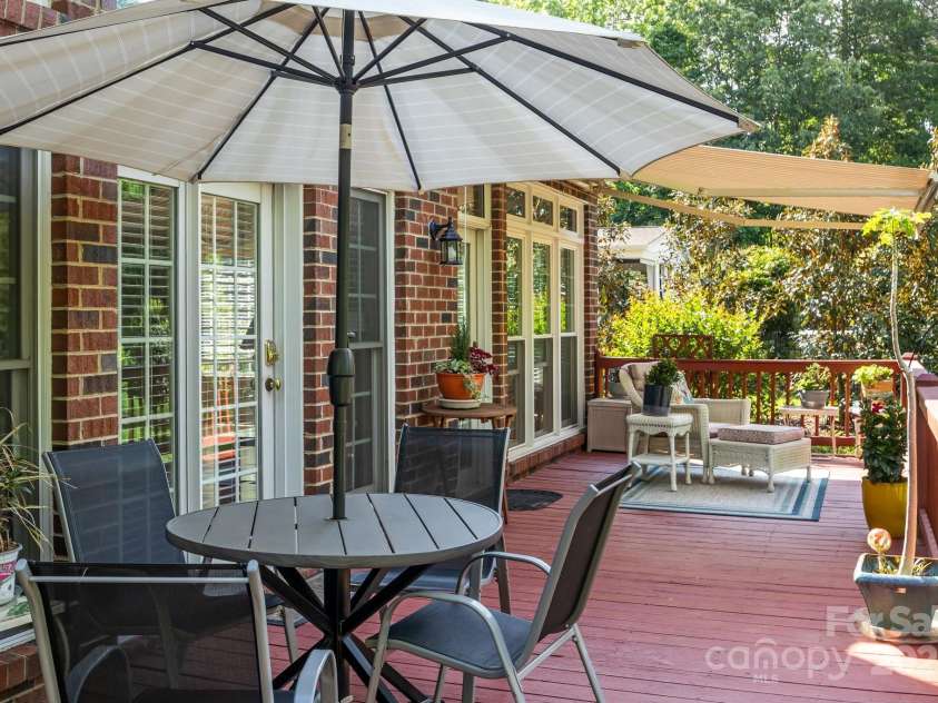 4563 Osprey Run Court, Denver, NC 28037.  MLS# CAR4250891, YatesRealty ID 17479. Electronic Retractable awning provides shade on back deck when needed!