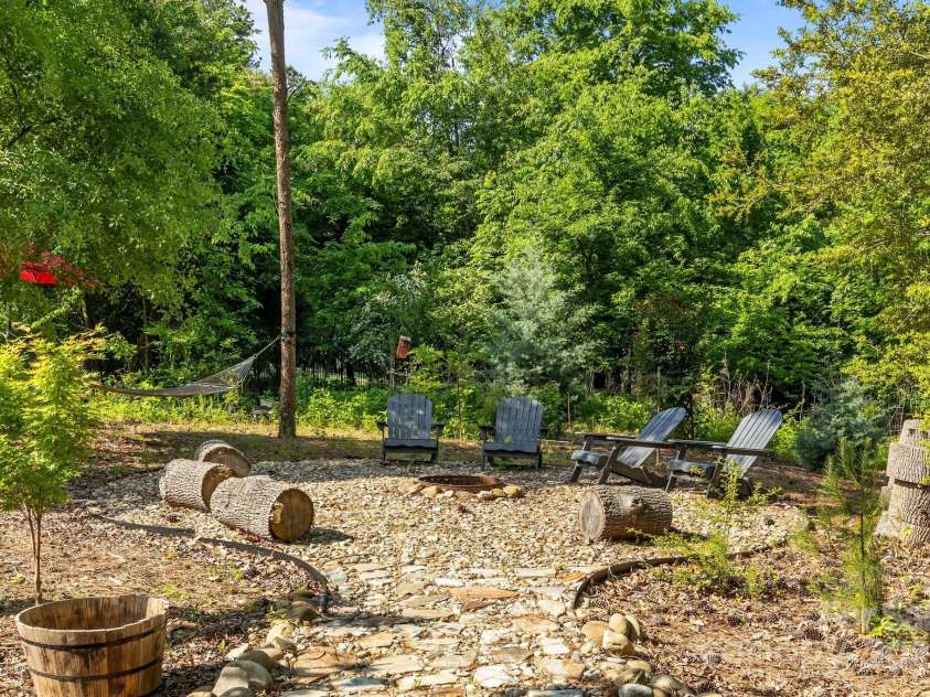 4563 Osprey Run Court, Denver, NC 28037.  MLS# CAR4250891, YatesRealty ID 17479. Firepit area with mature landscaping