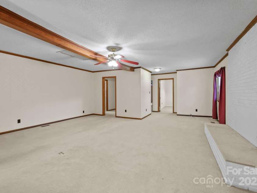 945 Alvin Hough Road, Midland, NC 28107.  MLS# CAR4309237, YatesRealty ID 1748. Large Living Room with wood trim 