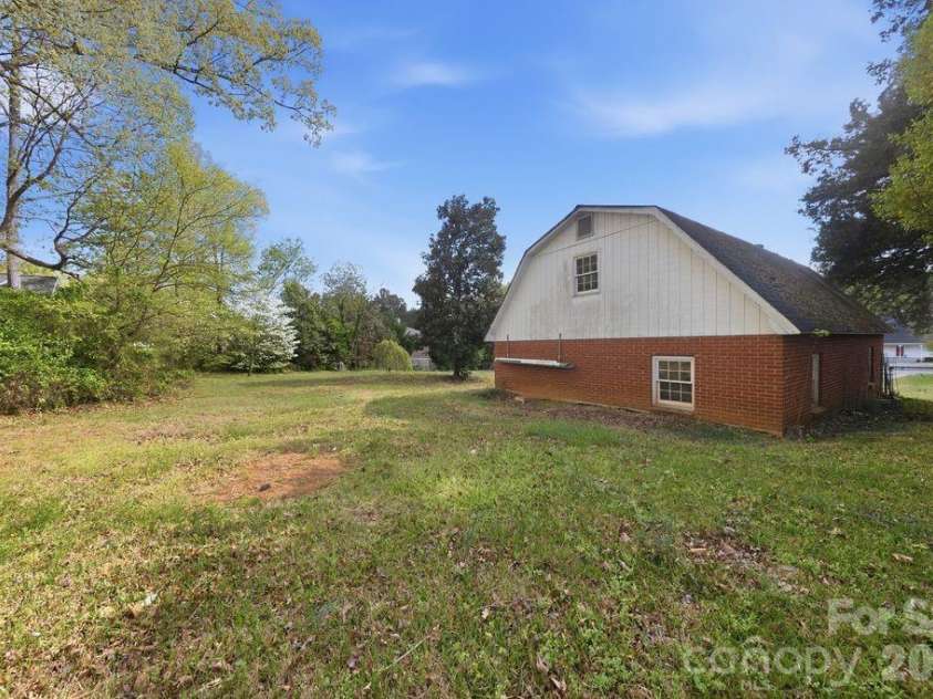 4108 Terry Terrace, Matthews, NC 28105.  MLS# CAR4363521, YatesRealty ID 17480. Back of Large Garage