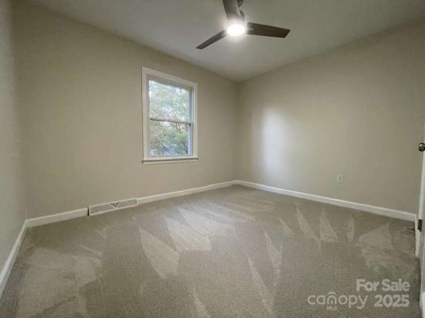 7608 Surreywood Place, Charlotte, NC 28270.  MLS# CAR4317171, YatesRealty ID 17485. Bedroom 2, Carpet and Ceiling Fan with LED