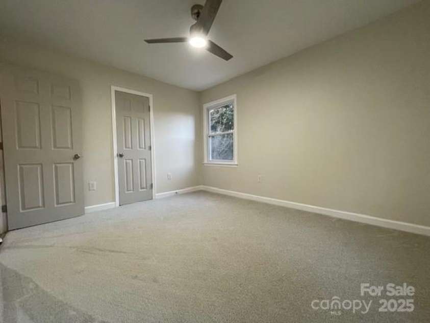 7608 Surreywood Place, Charlotte, NC 28270.  MLS# CAR4317171, YatesRealty ID 17485. Bedroom 3, Carpet and Ceiling Fan with LED