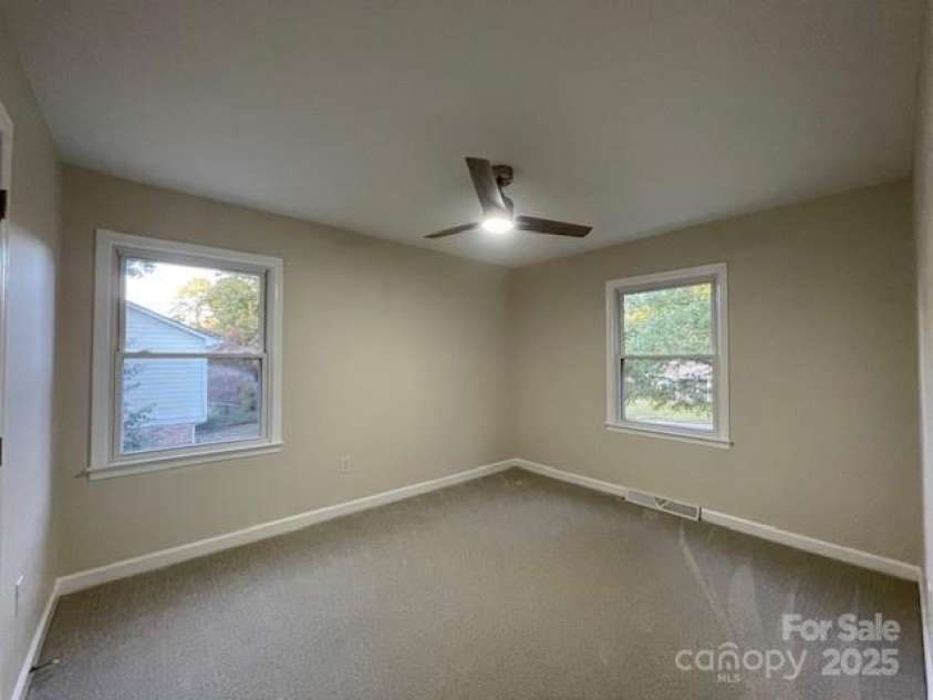 7608 Surreywood Place, Charlotte, NC 28270.  MLS# CAR4317171, YatesRealty ID 17485. Bedroom 4, Carpet and Ceiling Fan with LED