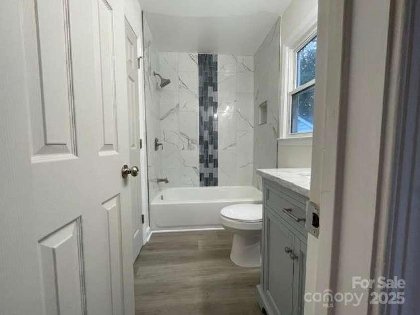 7608 Surreywood Place, Charlotte, NC 28270.  MLS# CAR4317171, YatesRealty ID 17485. Second  Grey Bath with designer Bath Tub Waterfall affect and Mirror has Medicine Cabinet