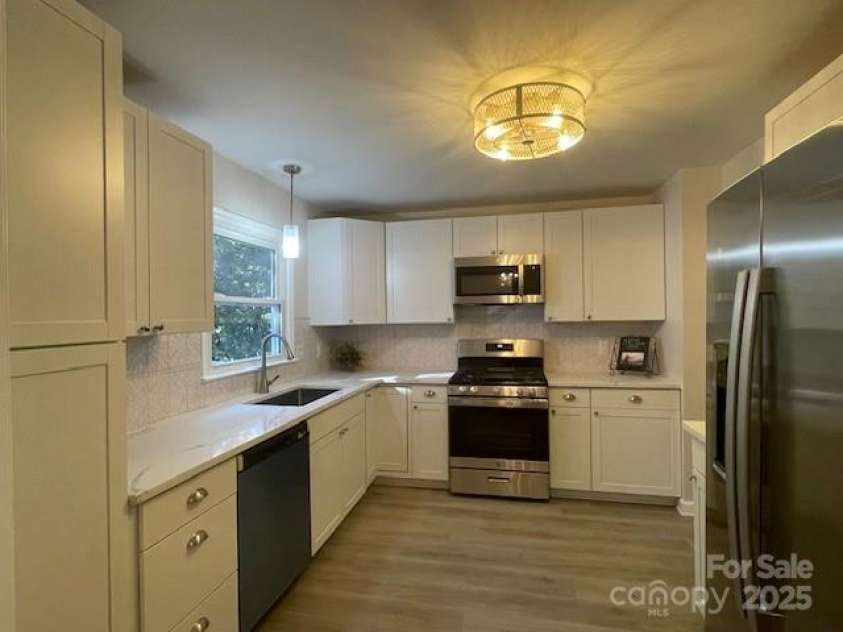 7608 Surreywood Place, Charlotte, NC 28270.  MLS# CAR4317171, YatesRealty ID 17485. Secondary view of Kitchen. Check out the Light with Ceiling fan