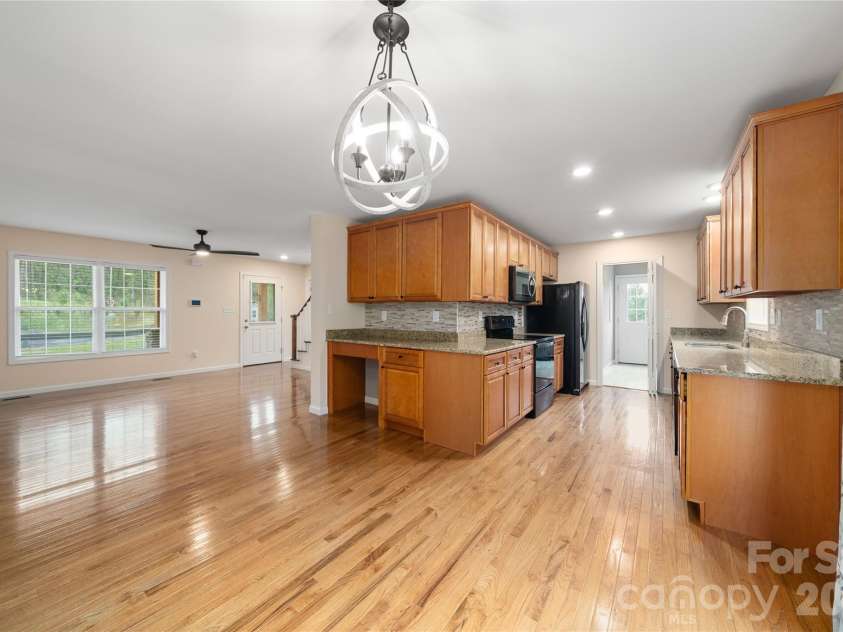105 Bluebell Ridge Lane, Weaverville, NC 28787.  MLS# CAR4303351, YatesRealty ID 17490. Open floor plan to dining, kitchen area. 
