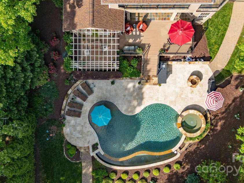 135 Sumter Drive, Mooresville, NC 28117.  MLS# CAR4252213, YatesRealty ID 17490. A brids-eye view of the pool and deck. Your summer playground.