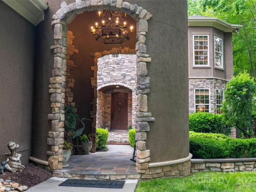 135 Sumter Drive, Mooresville, NC 28117.  MLS# CAR4252213, YatesRealty ID 17490. A chandelier lights your way through.