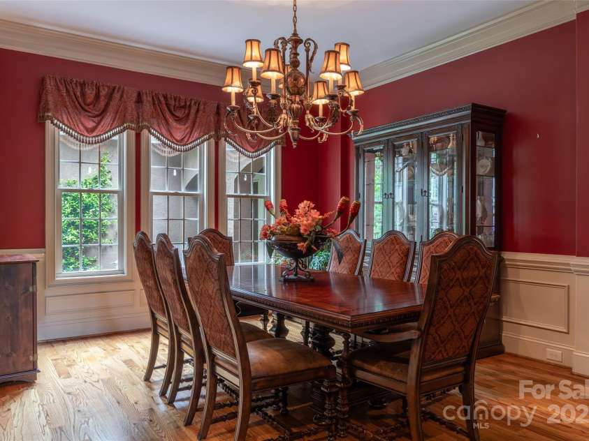 135 Sumter Drive, Mooresville, NC 28117.  MLS# CAR4252213, YatesRealty ID 17490. A grand dining room overlooks the front garden.