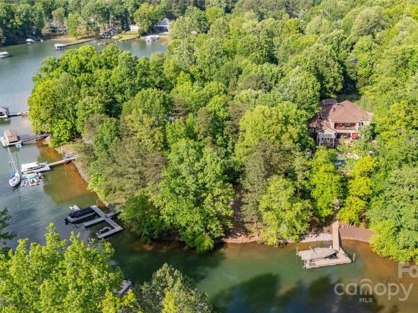 135 Sumter Drive, Mooresville, NC 28117.  MLS# CAR4252213, YatesRealty ID 17490. Located at the end of the cove, adjacent to protected shoreline, you can enjoy the lake without worry of boat traffic or wake.