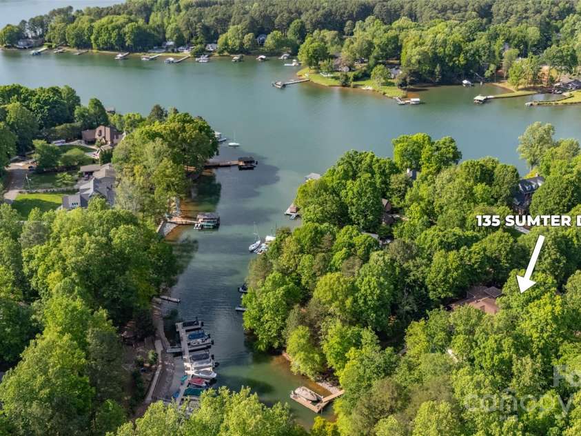 135 Sumter Drive, Mooresville, NC 28117.  MLS# CAR4252213, YatesRealty ID 17490. Open water is just around the corner from your private lakeside retreat.