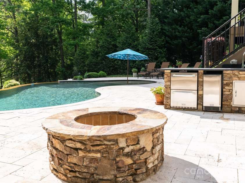 135 Sumter Drive, Mooresville, NC 28117.  MLS# CAR4252213, YatesRealty ID 17490. The gas starter fire-pit is sure to become a favorite hangout in the cooler months.