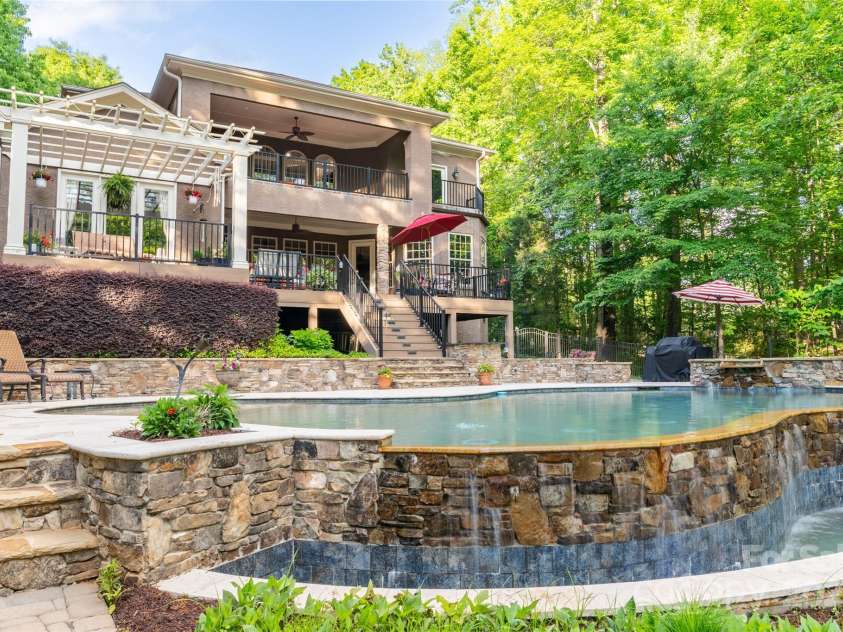 135 Sumter Drive, Mooresville, NC 28117.  MLS# CAR4252213, YatesRealty ID 17490. The relaxing, peaceful infinity waterfall will have you stress free in no time.