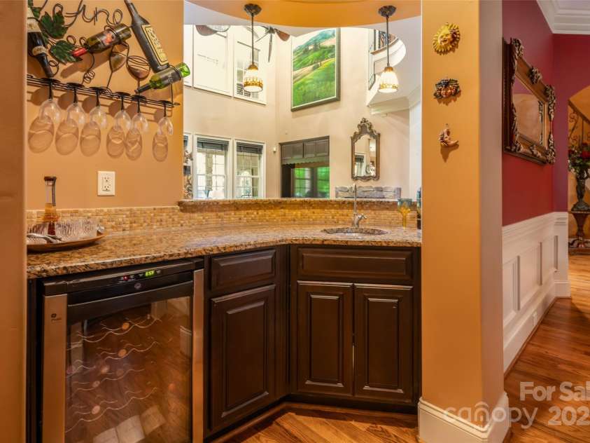 135 Sumter Drive, Mooresville, NC 28117.  MLS# CAR4252213, YatesRealty ID 17490. This elegant wet-bar with wine fridge will elevate every event.