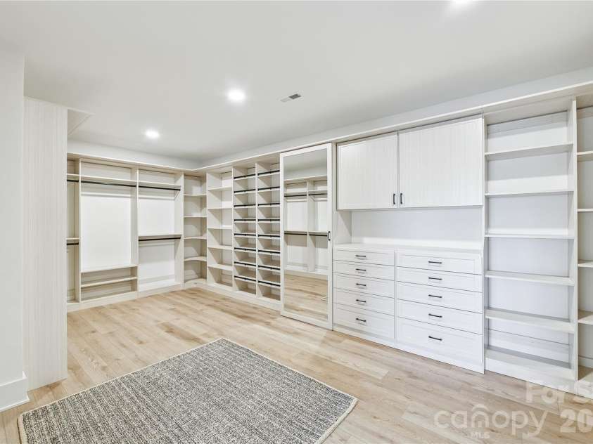 1027 Cox Road, Weddington, NC 28104.  MLS# CAR4299794, YatesRealty ID 17496. Custom primary closet 