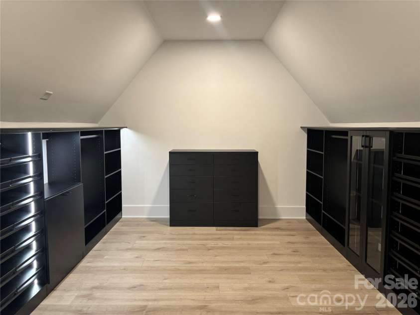 1027 Cox Road, Weddington, NC 28104.  MLS# CAR4299794, YatesRealty ID 17496. Custom primary closet with hidden back closet