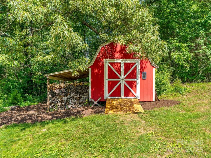 575 Upper Glady Fork Road, Candler, NC 28715.  MLS# CAR4258115, YatesRealty ID 17496. Adorable shed for yard tools