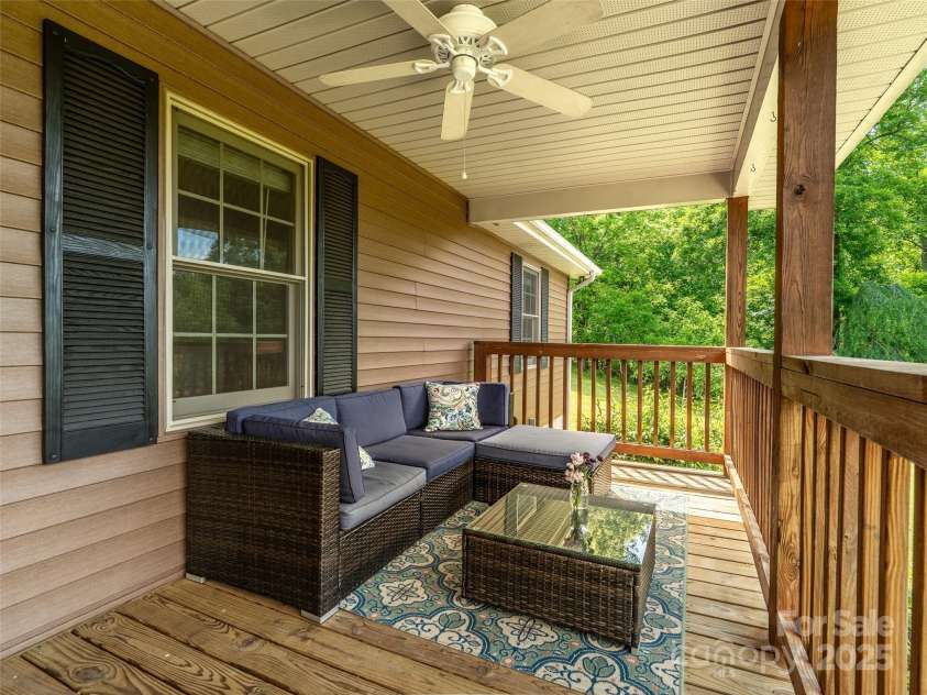 575 Upper Glady Fork Road, Candler, NC 28715.  MLS# CAR4258115, YatesRealty ID 17496. Ceiling fans on front porch to keep you cool