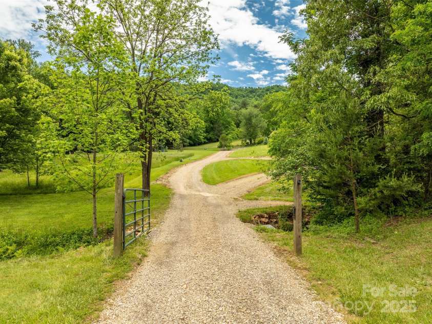 575 Upper Glady Fork Road, Candler, NC 28715.  MLS# CAR4258115, YatesRealty ID 17496. House set back off of road. Beautiful drive up to the home.