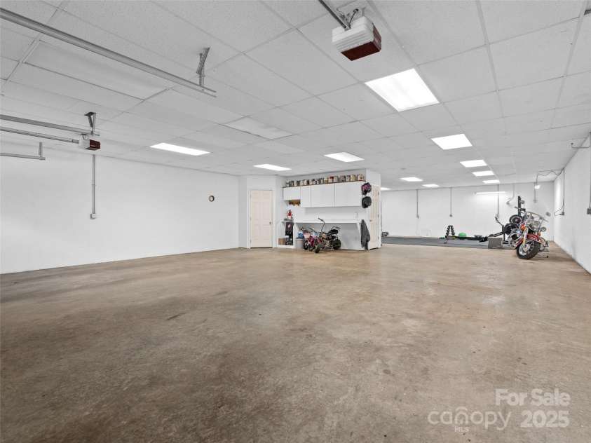 575 Upper Glady Fork Road, Candler, NC 28715.  MLS# CAR4258115, YatesRealty ID 17496. Plenty of  space to park cars in garage