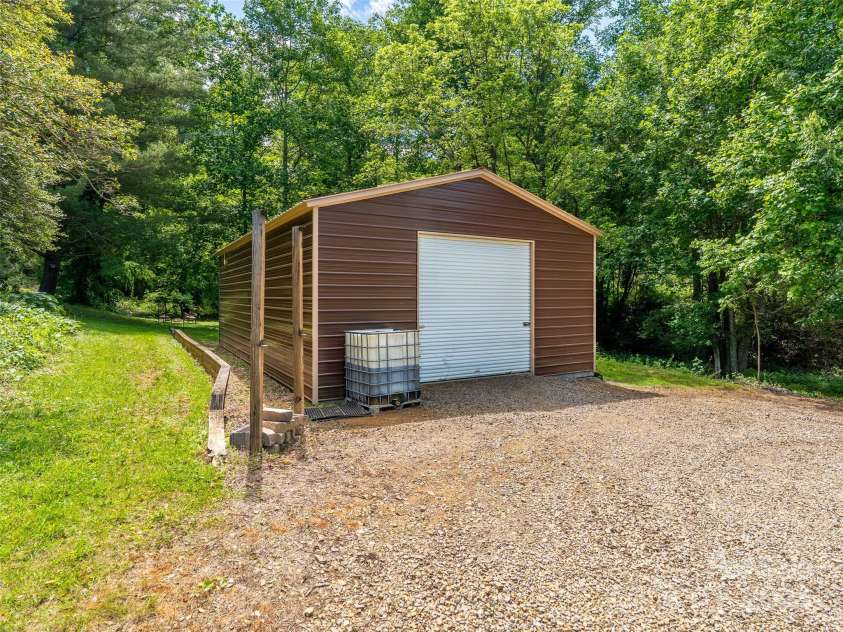 575 Upper Glady Fork Road, Candler, NC 28715.  MLS# CAR4258115, YatesRealty ID 17496. Shop for tinkering