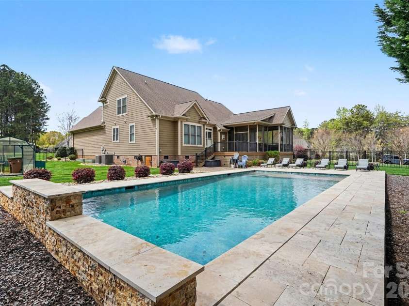 505 Williamsfield Drive, Shelby, NC 28150.  MLS# CAR4351239, YatesRealty ID 17504. The pool has a waterfall and sun-shelf.
