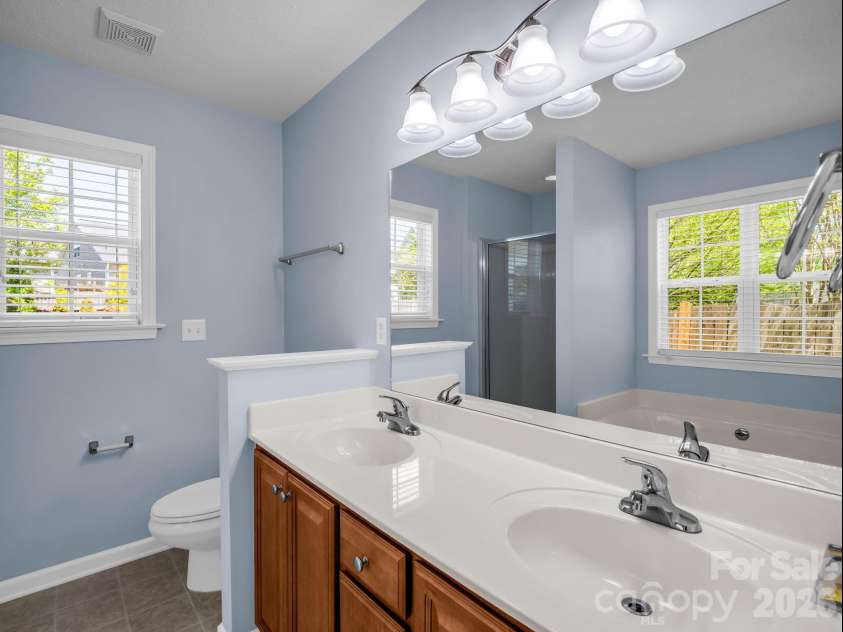 38 Black River Road, Fletcher, NC 28732.  MLS# CAR4372996, YatesRealty ID 17508. Double Vanity in Primary Bathroom