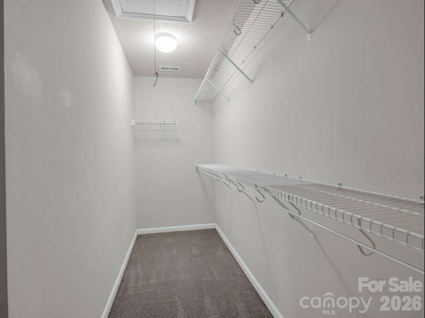 38 Black River Road, Fletcher, NC 28732.  MLS# CAR4372996, YatesRealty ID 17508. Walk-In Closet in Primary Bedroom