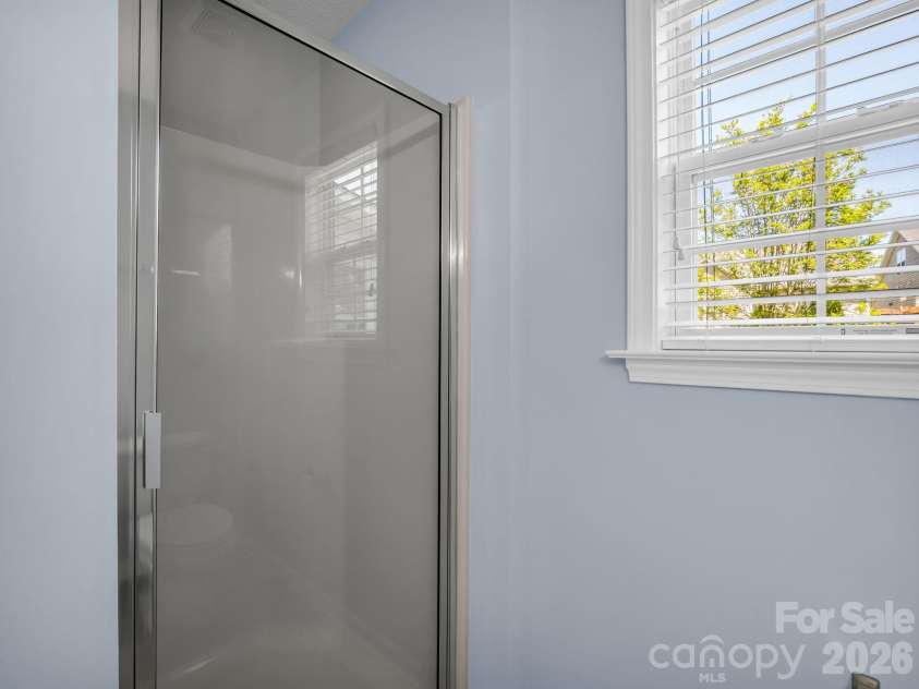 38 Black River Road, Fletcher, NC 28732.  MLS# CAR4372996, YatesRealty ID 17508. Walk-In Shower in Primary Bathroom