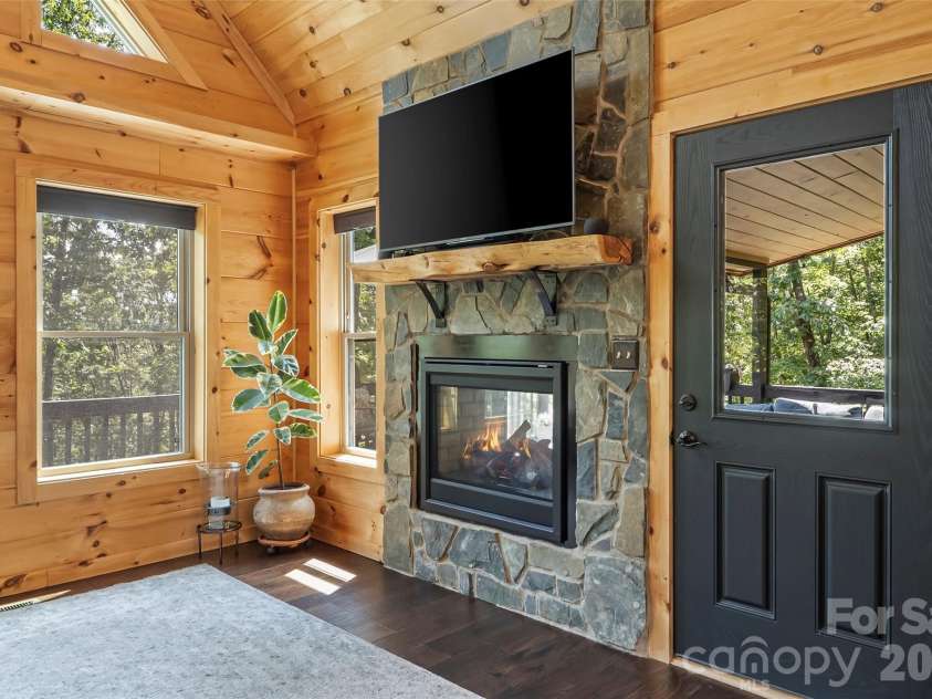 94 Osprey Roost Drive, Nebo, NC 28761.  MLS# CAR4296023, YatesRealty ID 17519. Double sided fireplace