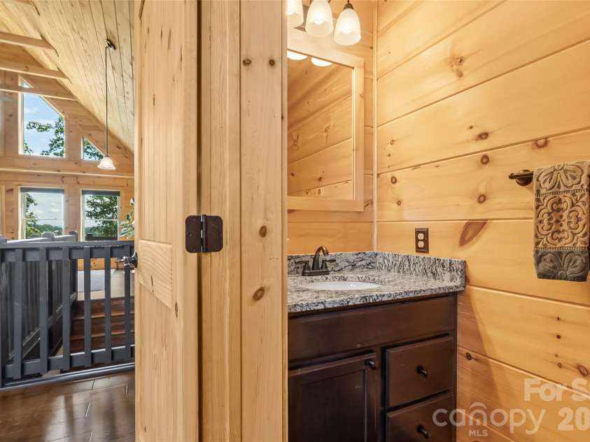 94 Osprey Roost Drive, Nebo, NC 28761.  MLS# CAR4296023, YatesRealty ID 17519. Half bath on main level