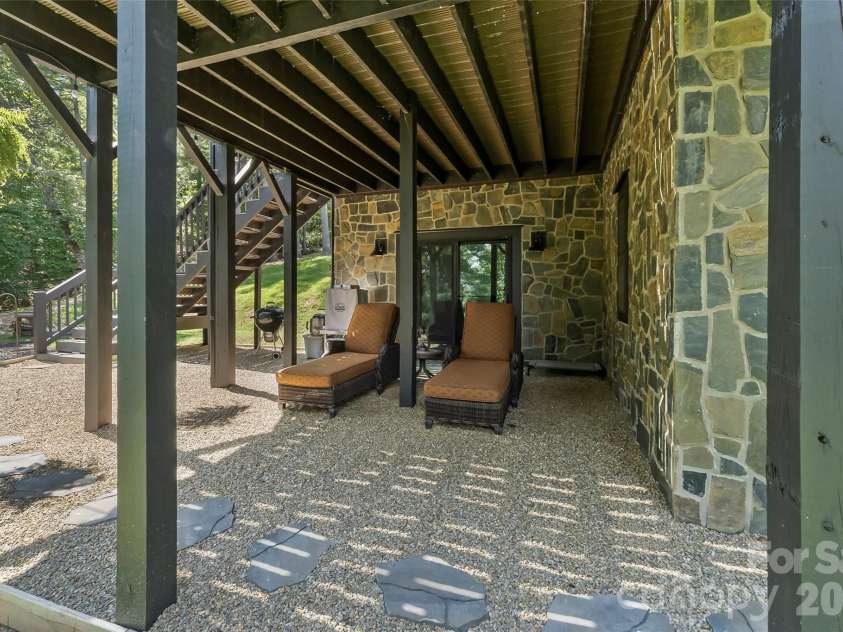 94 Osprey Roost Drive, Nebo, NC 28761.  MLS# CAR4296023, YatesRealty ID 17519. Lower level seating area