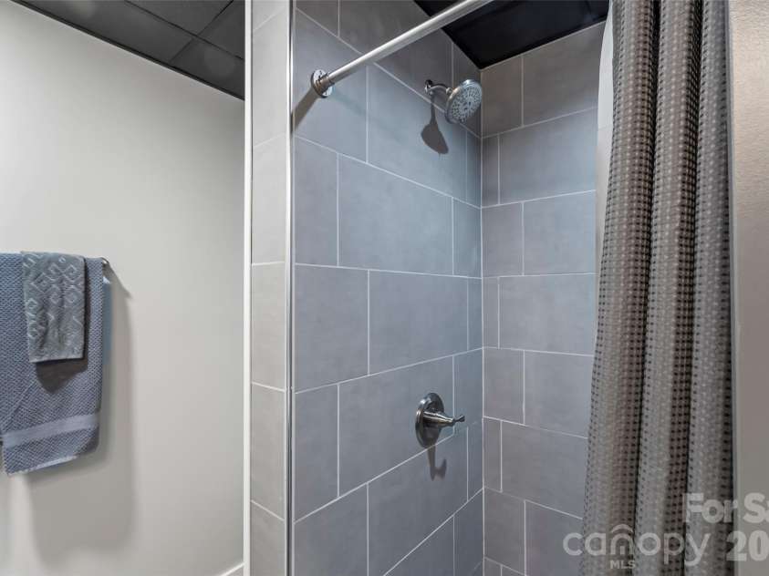 94 Osprey Roost Drive, Nebo, NC 28761.  MLS# CAR4296023, YatesRealty ID 17519. Lower level shower