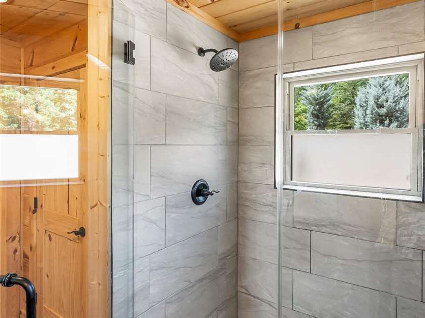 94 Osprey Roost Drive, Nebo, NC 28761.  MLS# CAR4296023, YatesRealty ID 17519. Primary shower