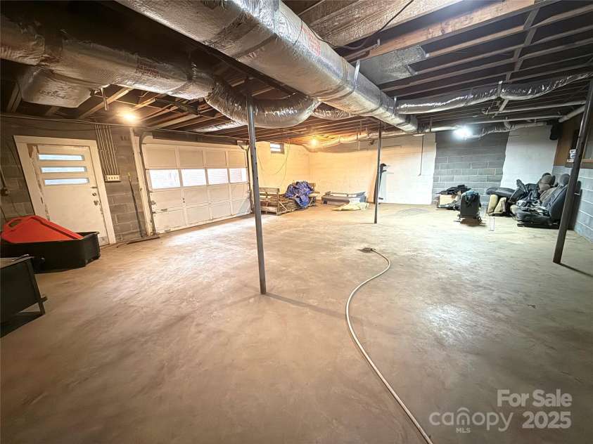3158 Salisbury Highway, Statesville, NC 28677.  MLS# CAR4266177, YatesRealty ID 17524. Garage entry basement