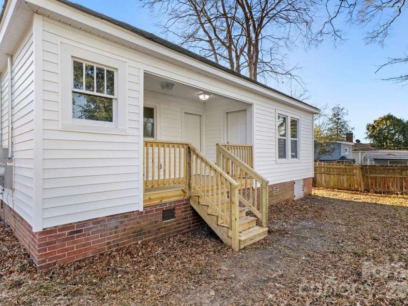 266 Moore Drive, Concord, NC 28025.  MLS# CAR4330660, YatesRealty ID 17526. Back deck with shared entrance