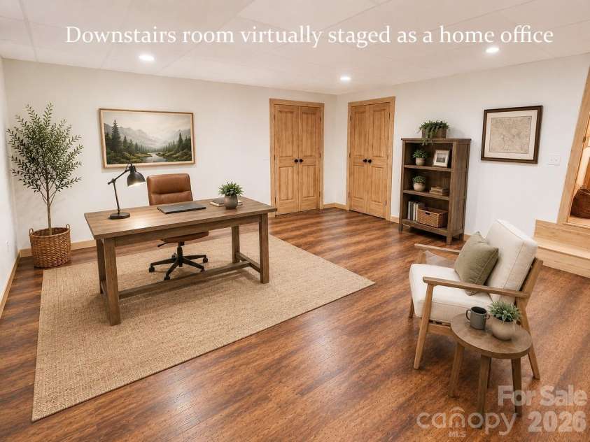 14 Weeping Cherry Forest Road, Fairview, NC 28730.  MLS# CAR4356619, YatesRealty ID 17536. Lower level bonus room/bedroom/home office with direct access to the expansive screened-in porch staged as a home office.