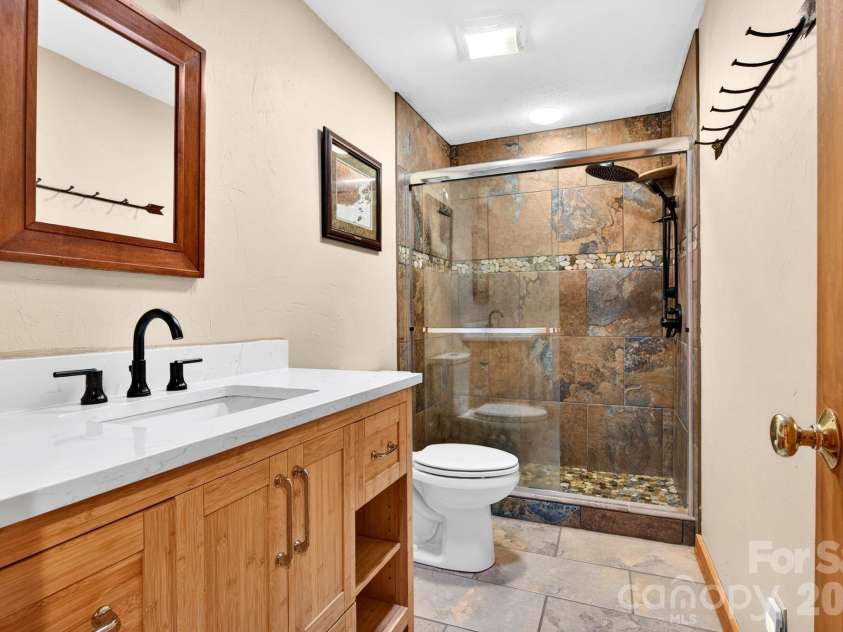 14 Weeping Cherry Forest Road, Fairview, NC 28730.  MLS# CAR4356619, YatesRealty ID 17536. Recently renovated Guest Bathroom.