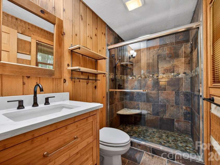 14 Weeping Cherry Forest Road, Fairview, NC 28730.  MLS# CAR4356619, YatesRealty ID 17536. Recently renovated primary en-suite bathroom.