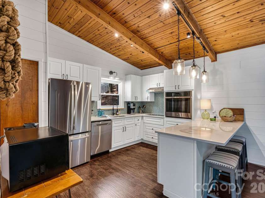 462 Charlotte Drive, Lake Lure, NC 28746.  MLS# CAR4375186, YatesRealty ID 17548. Kitchen with Breakfast bar