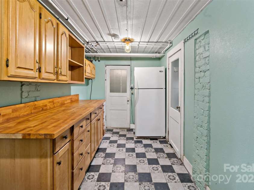 147 Preservation Way, Waynesville, NC 28786.  MLS# CAR4264584, YatesRealty ID 17550. Basement hallway