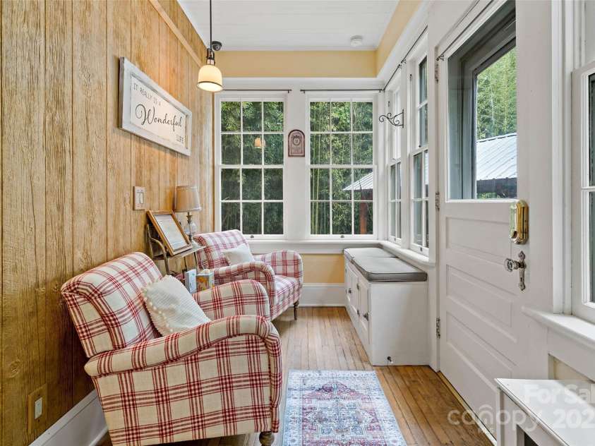147 Preservation Way, Waynesville, NC 28786.  MLS# CAR4264584, YatesRealty ID 17550. Cozy enclosed side porch