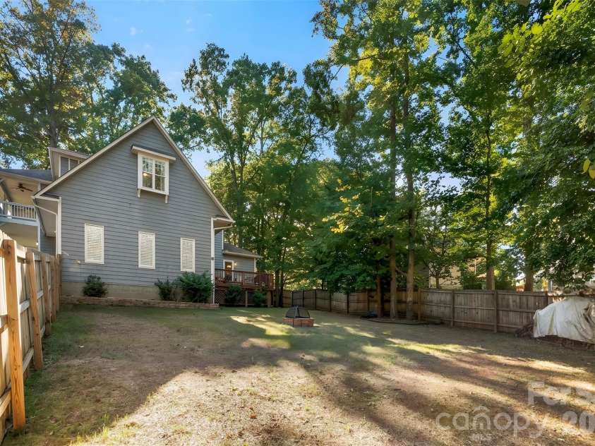 109 Fulton Farms Lane, Mooresville, NC 28117.  MLS# CAR4429020, YatesRealty ID 17552. Backyard with firepit