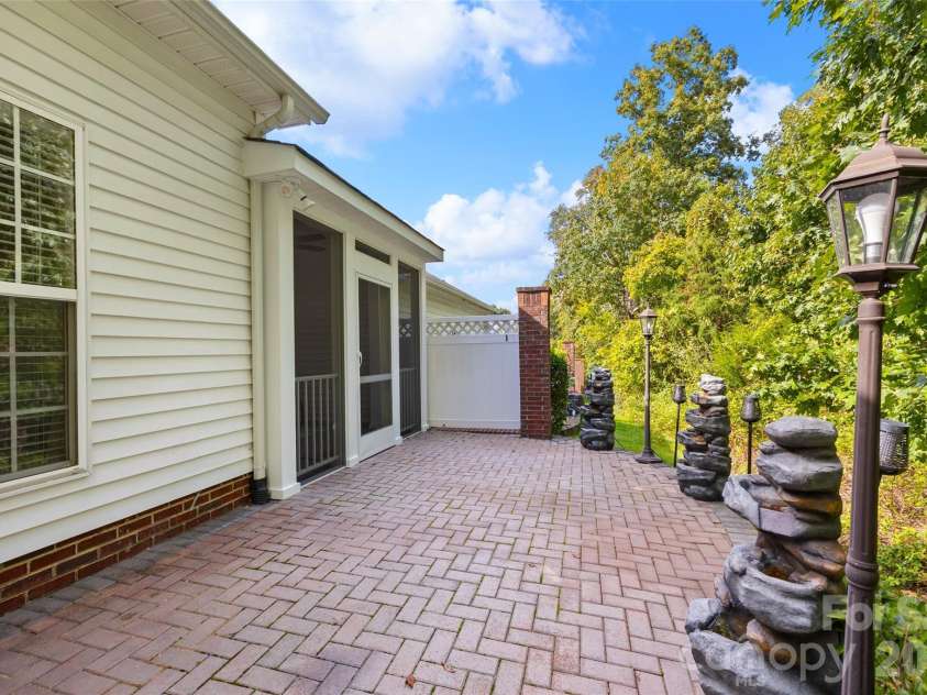 14569 Greenpoint Lane, Huntersville, NC 28078.  MLS# CAR4327431, YatesRealty ID 17560. Amazing patio space backing to trees!